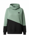 Two-tone green and black hoodie with a small logo on a white background
